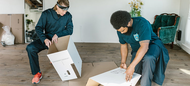 professional packers assembling boxes