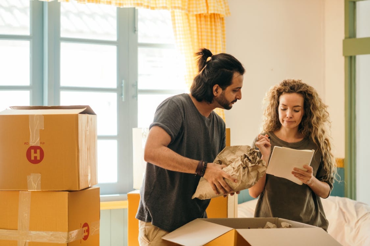couple packing things in boxes