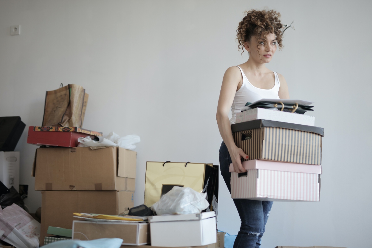 young woman packing and talking about moving out of your parents home for the first time