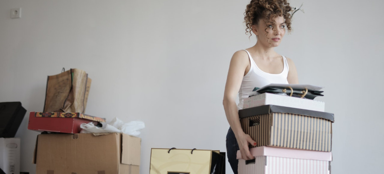 a woman decluttering in order to make tiny apartments in Soho more livable