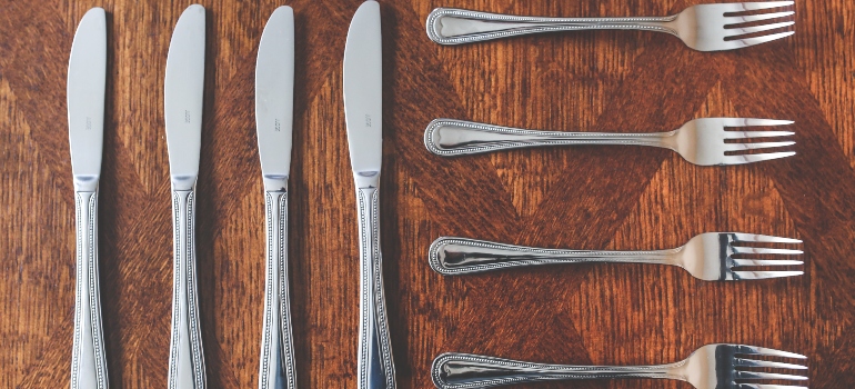 A set of cutlery is laid on the table.