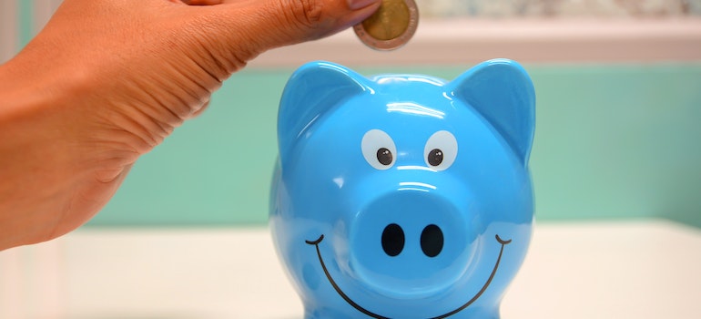 Putting money in a piggy bank